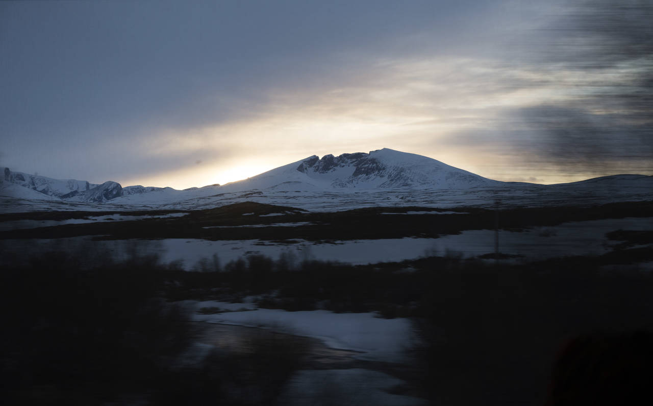 Det er ventet mye snø og sludd blant annet i Dovrefjell, her med Snøhetta i bakgrunnen. Arkivfoto: Gorm Kallestad / NTB scanpix