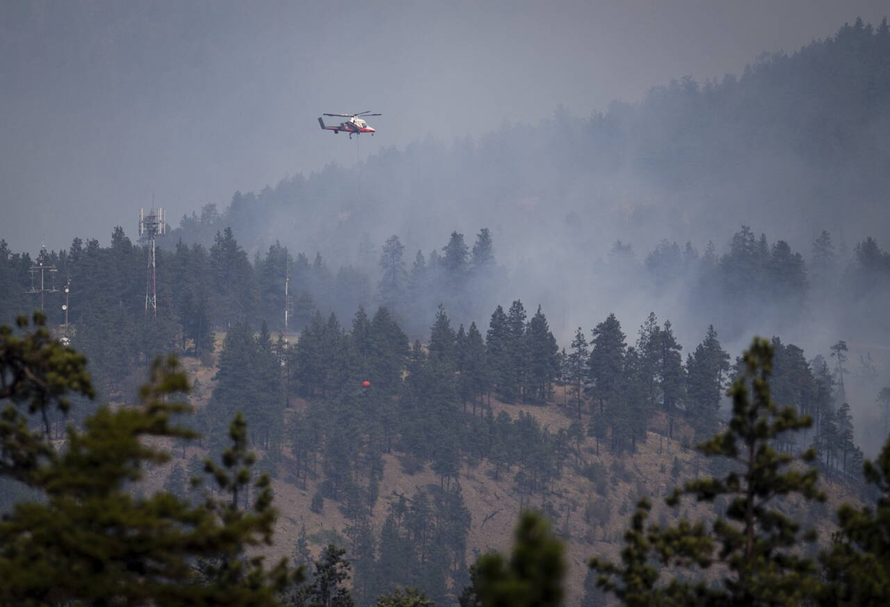Skogbranner i British Columbia i Canada blir forsøkt slukket i starten av juli. Foto: Darryl Dyck/The Canadian Press via AP / AP / NTB