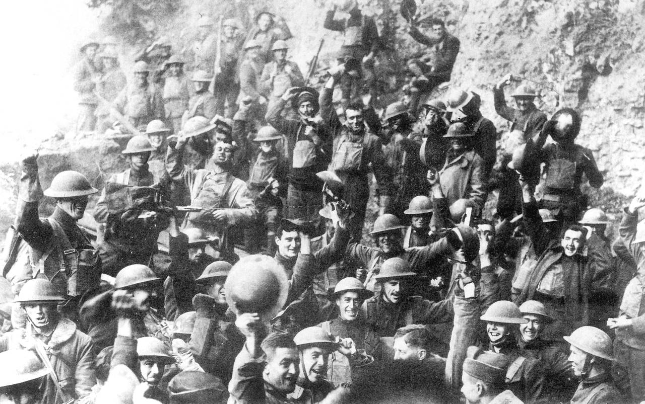 Men of U.S. 64th Regiment, 7th Infantry Division, celebrate the news of the Armistice, 11 November 1918. By U.S. Army (U.S. National Archive) [Public domain or Public domain], via Wikimedia Commons